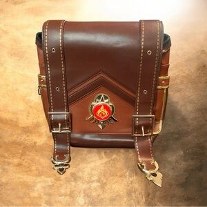 Leather Genshin Impact Klee Cosplay Backpack with fire-element emblem.